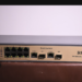 8포트 PoE 스위치 근접 사진, RJ45 포트와 SFP 업링크 슬롯이 보이는 산업용 랜카드 장비